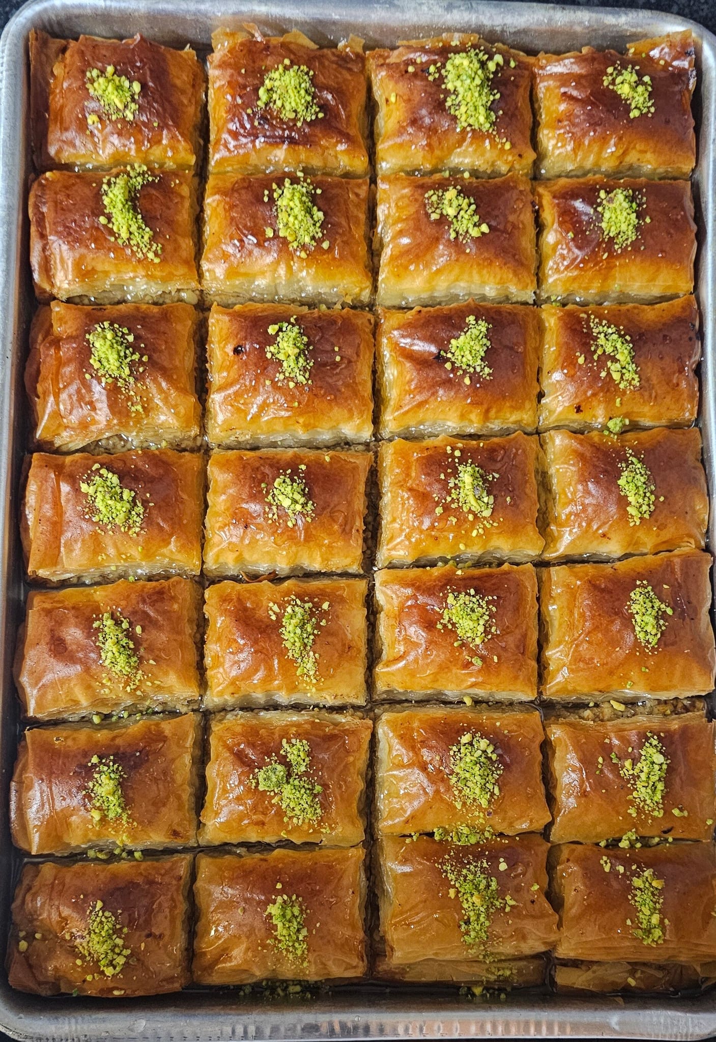 A fresh tray of pistachio baklava