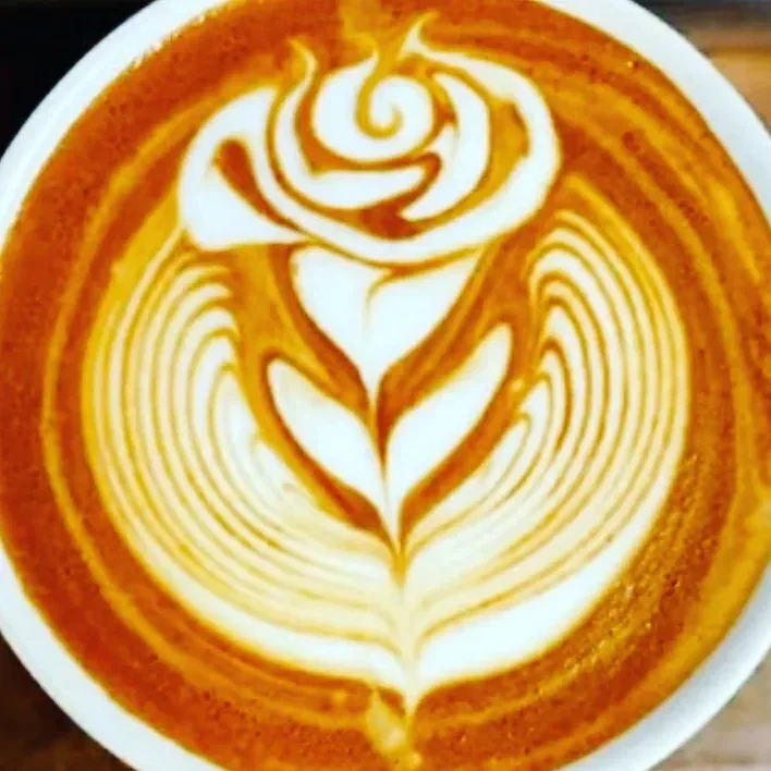A latte with rosetta art
