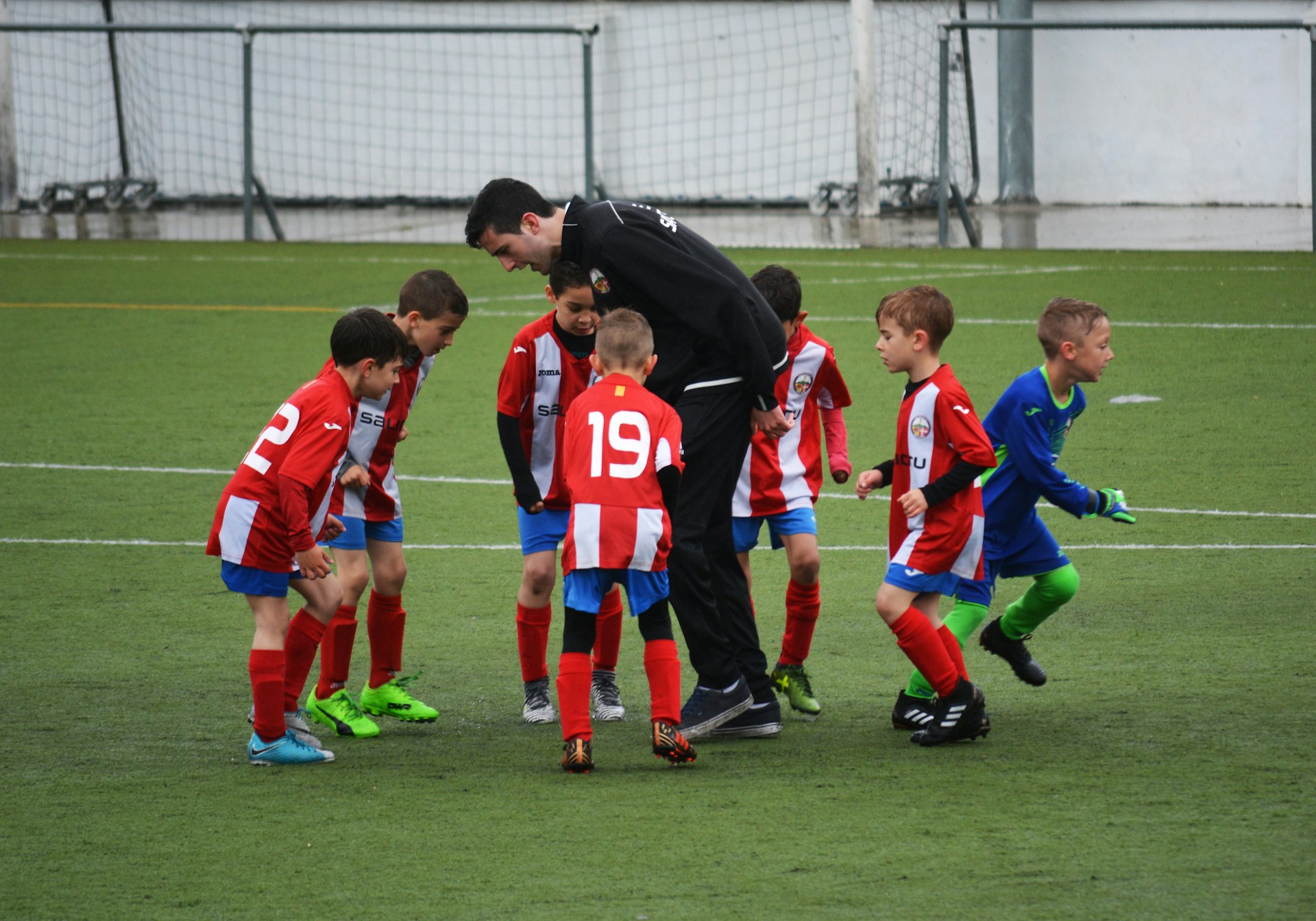 Coach and player working on technique